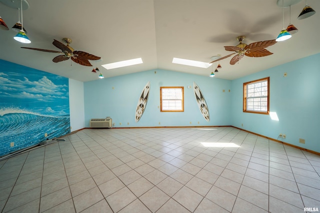 2268 E Knox St, Galesburg, IL 61401 - spare room with light tile patterned floors, ceiling fan, lofted ceiling with skylight, and baseboards