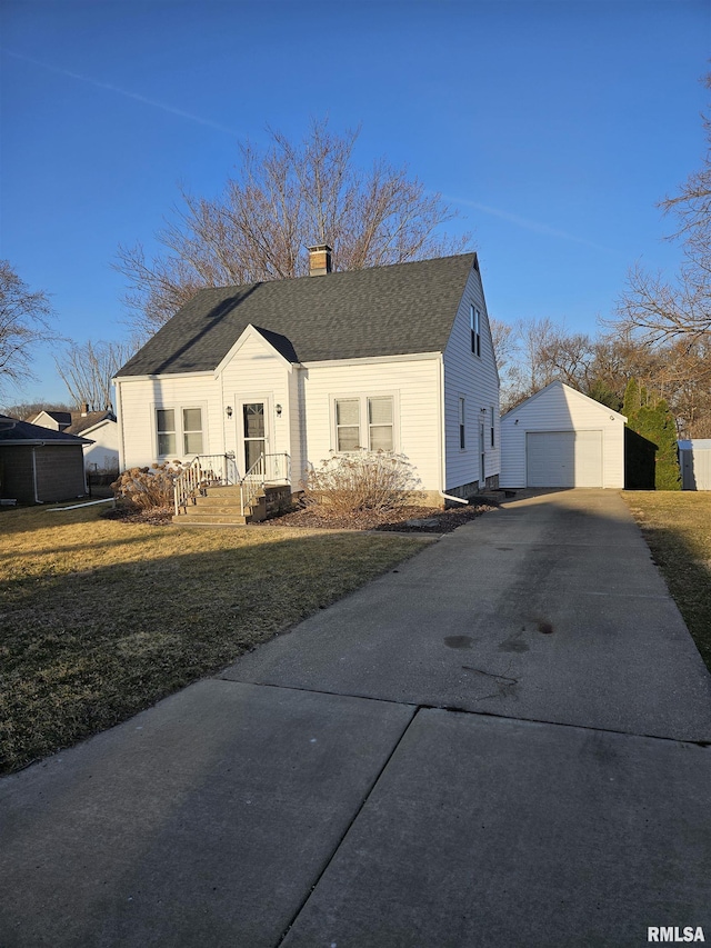 bungalow featuring roof with shingles, driveway, a chimney, an outdoor structure, and a detached garage