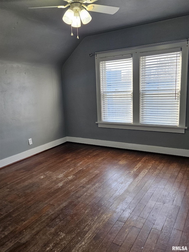 bonus room with lofted ceiling, baseboards, dark wood-style flooring, and ceiling fan