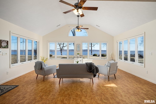 living room with carpet, vaulted ceiling, a ceiling fan, and baseboards