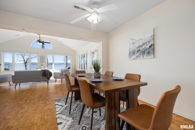 dining space with baseboards, lofted ceiling, visible vents, and ceiling fan