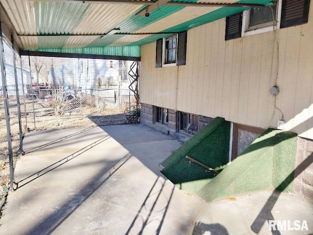 view of patio / terrace featuring fence