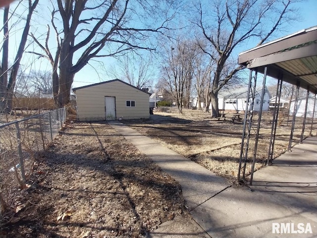 exterior space with an outdoor structure and fence