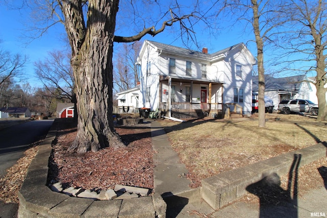 view of front of home featuring a porch and a front yard