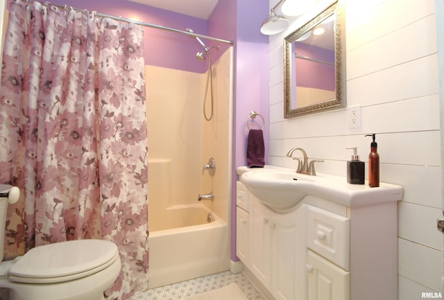 full bathroom featuring vanity, shower / bath combination with curtain, and toilet