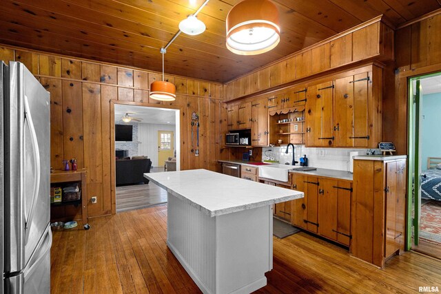 dining space with wood finished floors