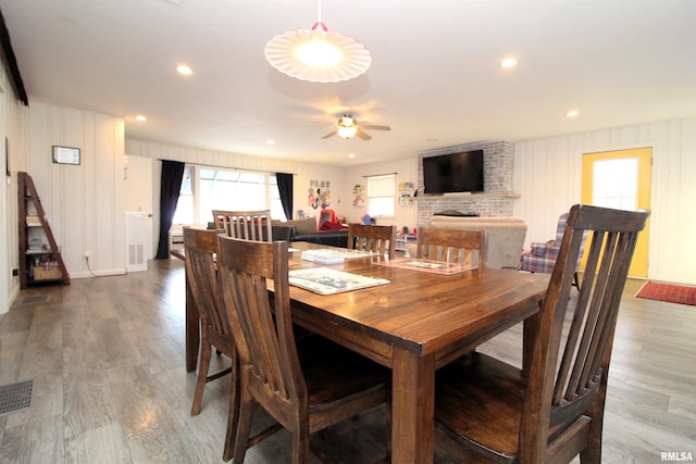 dining space with visible vents, recessed lighting, and wood finished floors