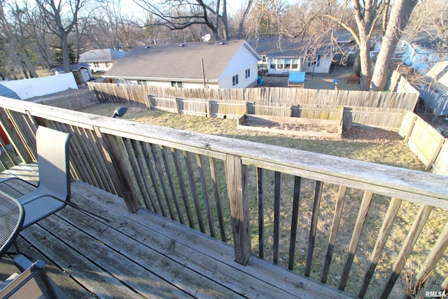 deck with a fenced backyard