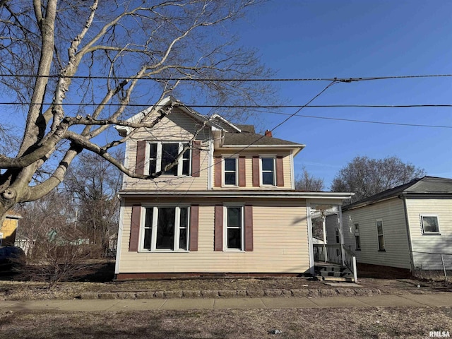 view of side of property featuring a chimney