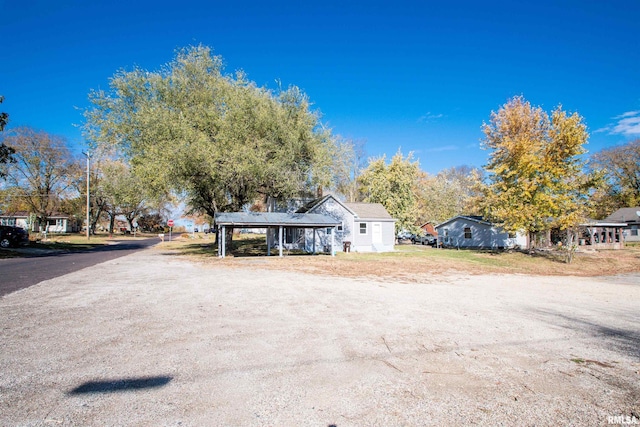 view of front of home with a carport