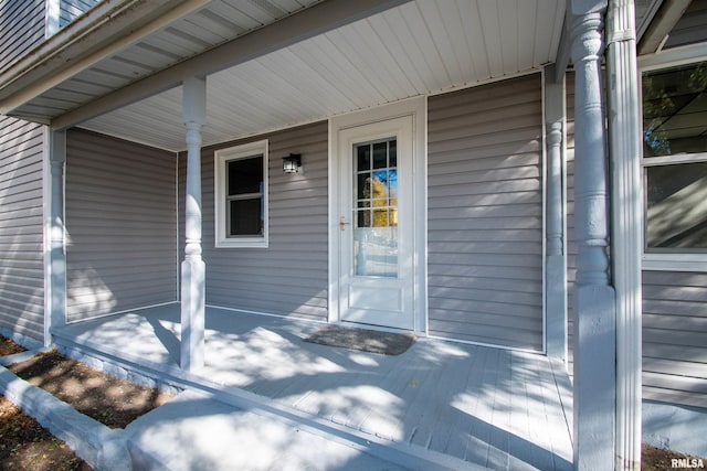 doorway to property featuring covered porch