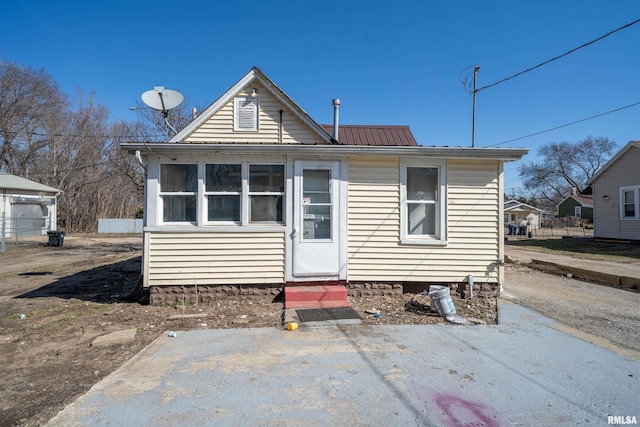 back of property with metal roof