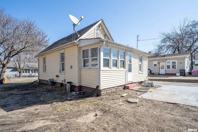 view of side of home with entry steps