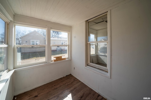 unfurnished sunroom featuring wood ceiling