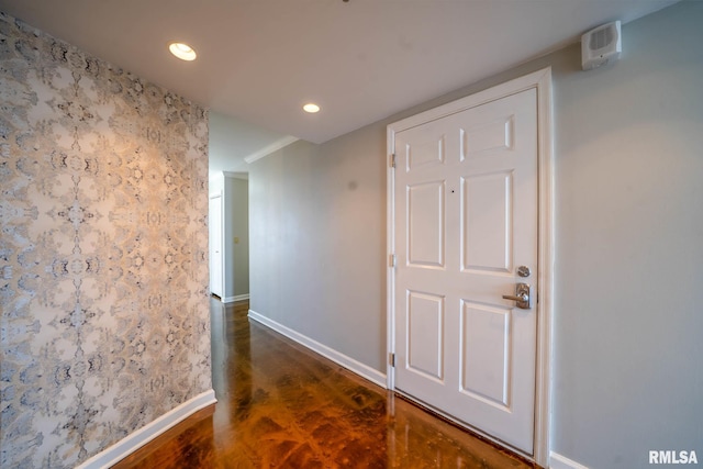 hall with recessed lighting, baseboards, and finished concrete flooring