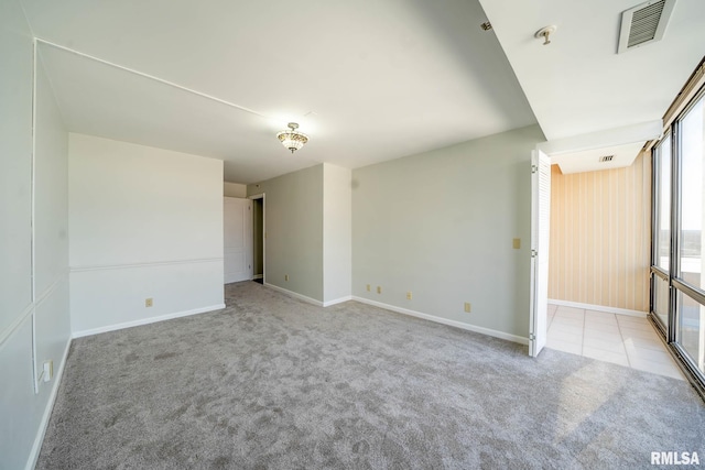 unfurnished bedroom with visible vents, baseboards, and carpet flooring