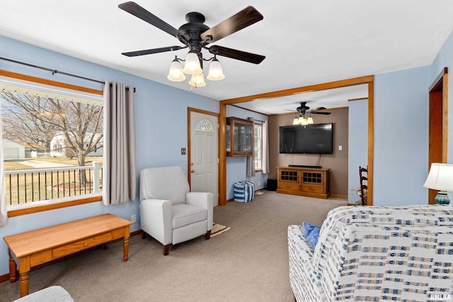 bedroom with baseboards, light colored carpet, and a ceiling fan