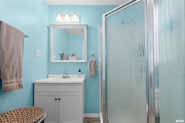 bathroom with vanity and a stall shower