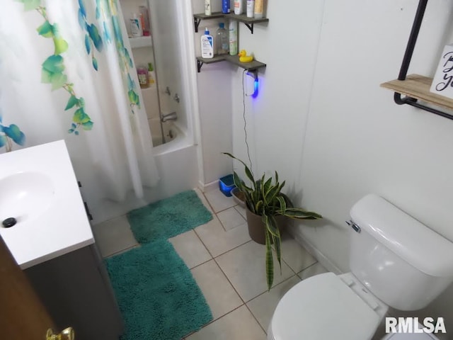 full bath with toilet, shower / bath combo, vanity, and tile patterned flooring