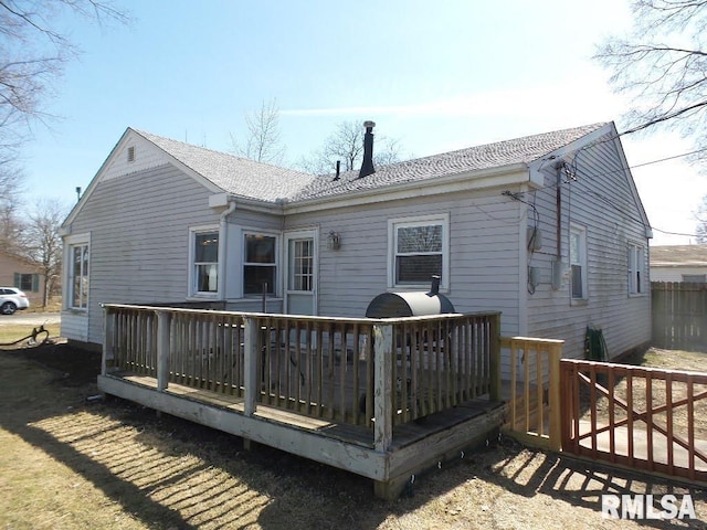 back of property featuring a deck