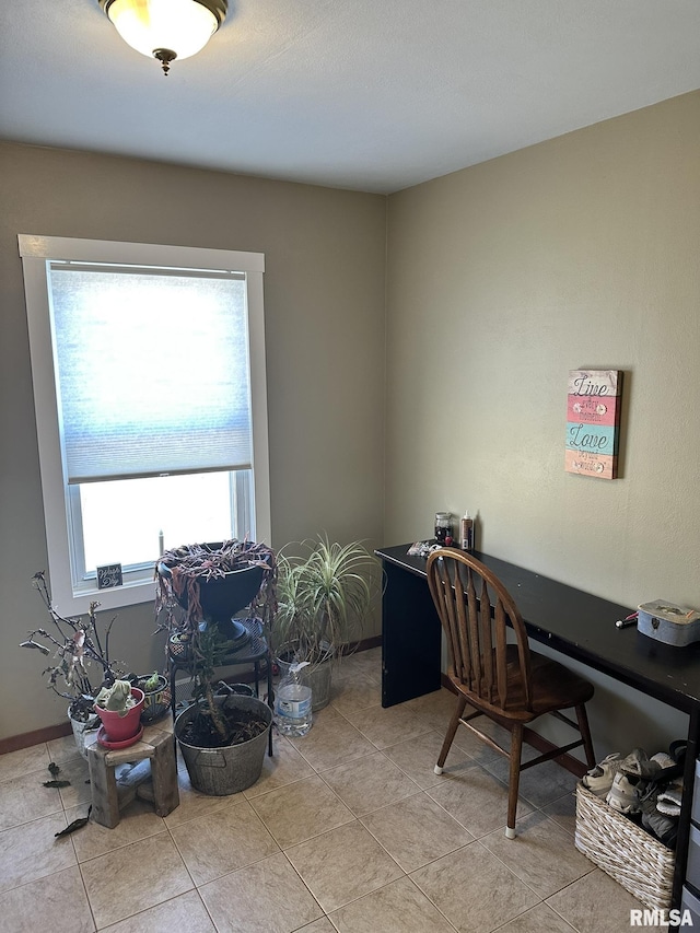 office featuring light tile patterned flooring and baseboards