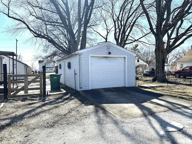 detached garage with concrete driveway