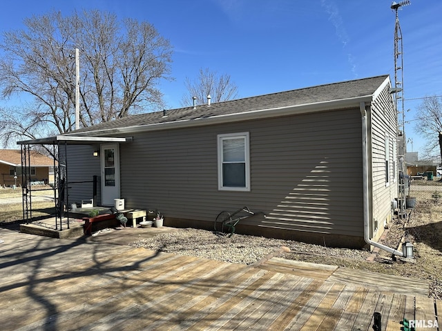 back of property with a wooden deck