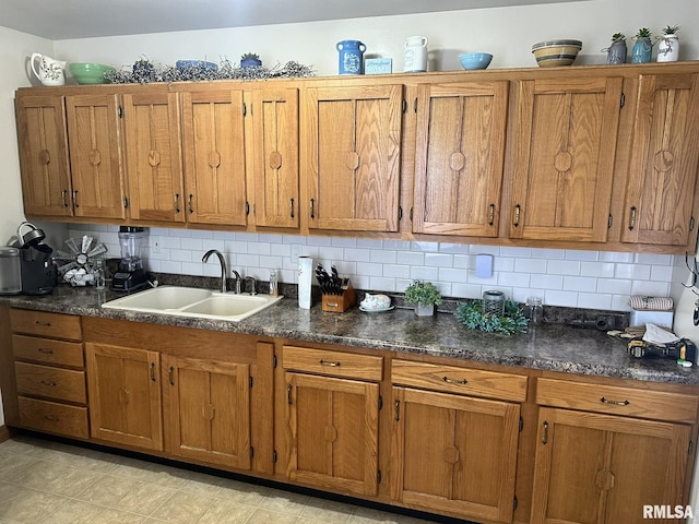 kitchen with brown cabinets and a sink