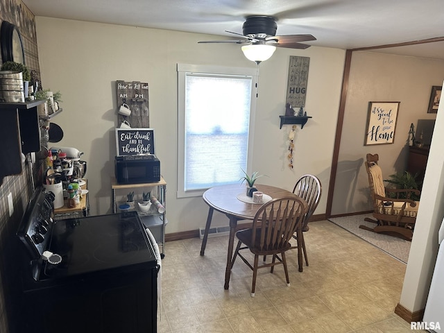 dining area featuring baseboards and ceiling fan