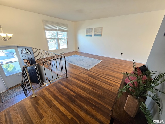 interior space with an inviting chandelier, wood finished floors, and a wealth of natural light