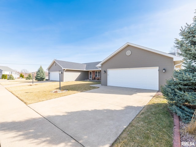 single story home featuring a garage, a front lawn, and driveway