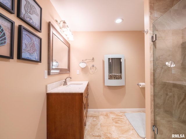 full bath featuring recessed lighting, a shower stall, vanity, and baseboards