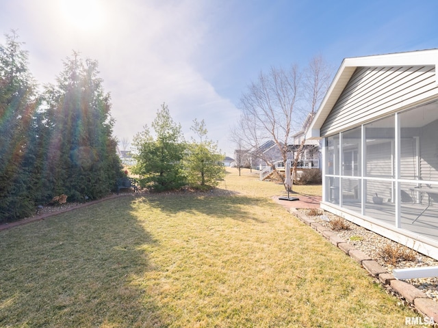 view of yard with a sunroom