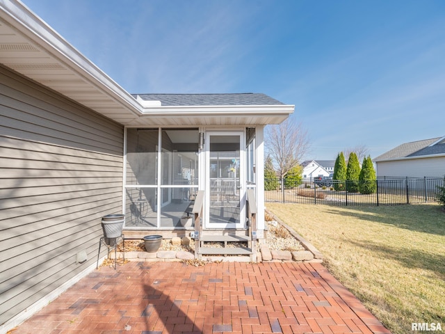 view of patio / terrace with fence and a sunroom