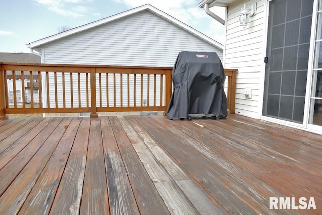 wooden deck featuring grilling area