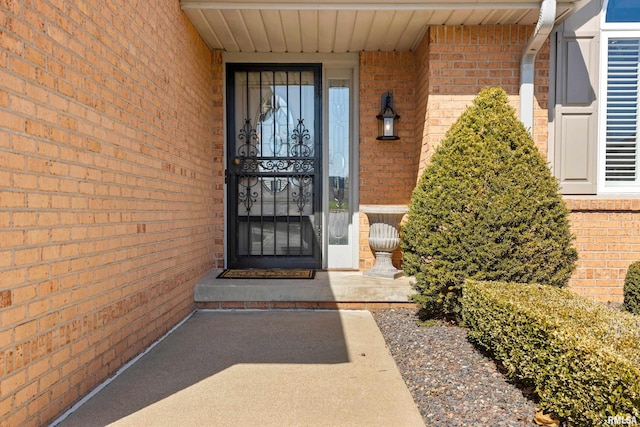 property entrance with brick siding