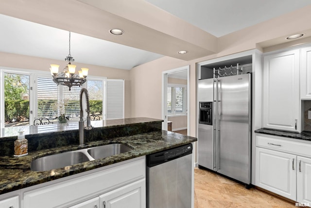 kitchen featuring a sink, plenty of natural light, appliances with stainless steel finishes, and white cabinetry