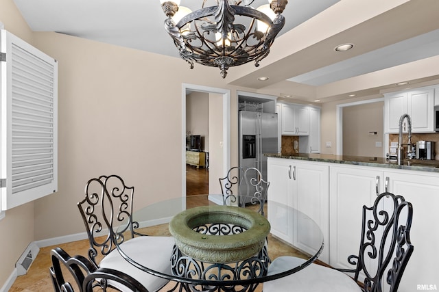 dining room with light tile patterned floors, visible vents, baseboards, an inviting chandelier, and recessed lighting