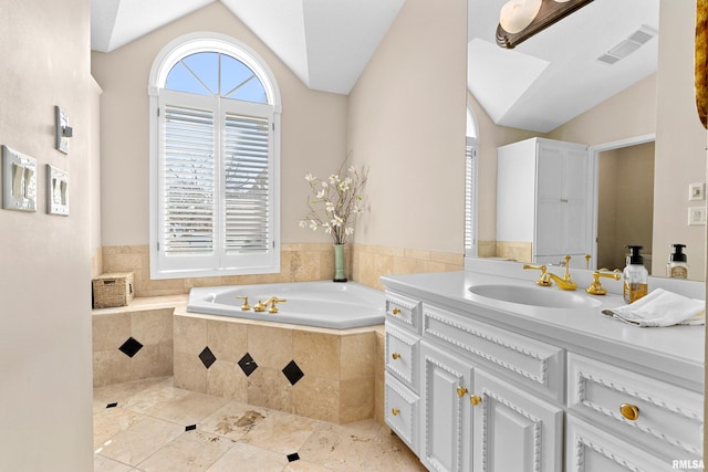 bathroom featuring visible vents, a garden tub, tile patterned flooring, vanity, and vaulted ceiling