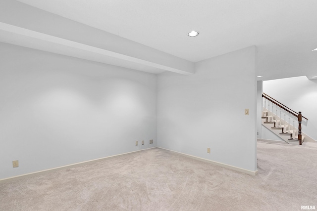 spare room with stairway, baseboards, beam ceiling, recessed lighting, and carpet flooring