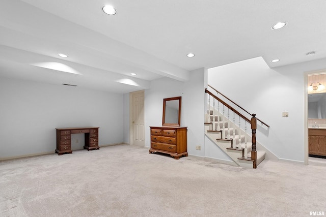 below grade area featuring stairway, recessed lighting, and carpet flooring