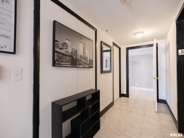 hallway featuring baseboards