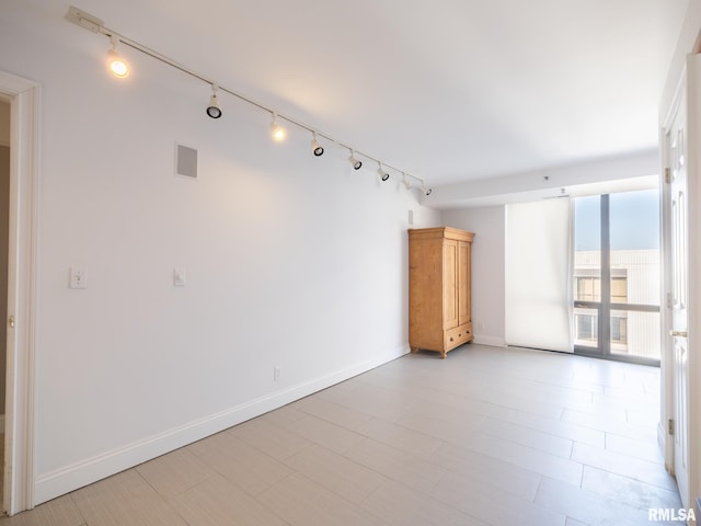 empty room featuring visible vents and baseboards