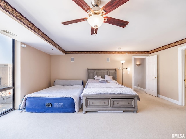 bedroom with visible vents, baseboards, light colored carpet, and a ceiling fan