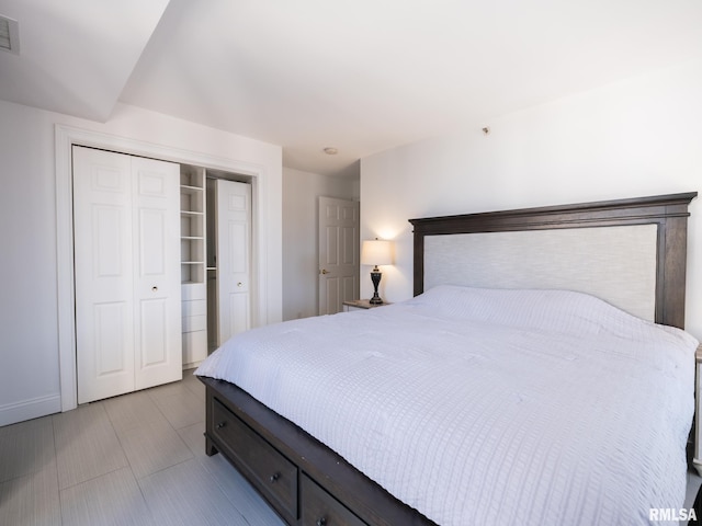 bedroom with visible vents and a closet