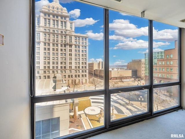 interior space featuring carpet floors and a city view