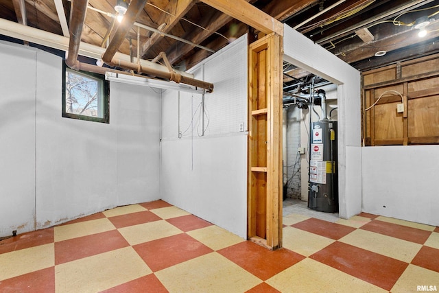 basement with light floors and gas water heater