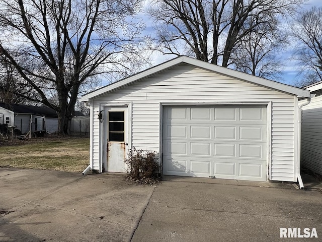 detached garage featuring driveway