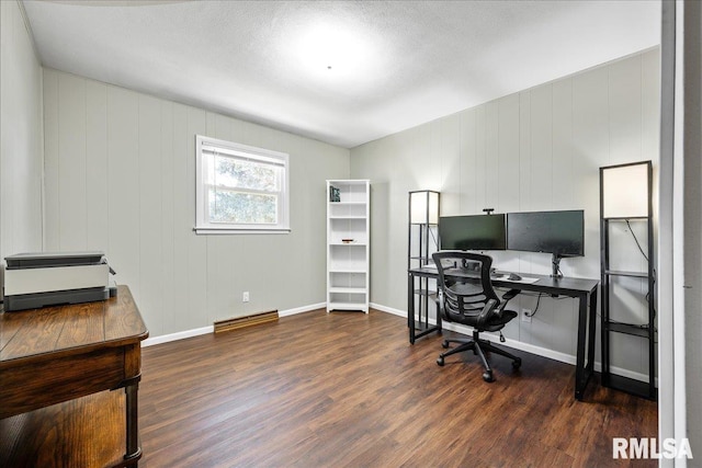 home office with baseboards and wood finished floors