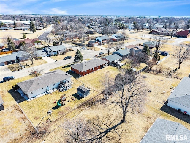 birds eye view of property with a residential view